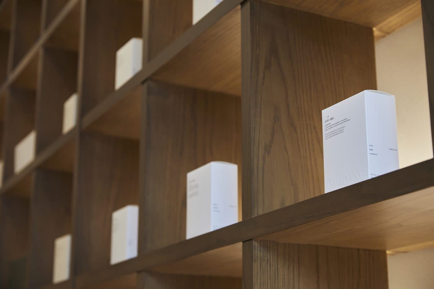 Interior of the JAIMDANG clinic with wooden shelving and a waiting area